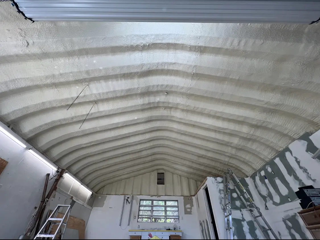 Spray polyurethane foam applied to the underside of a metal roof deck in Burrillville
